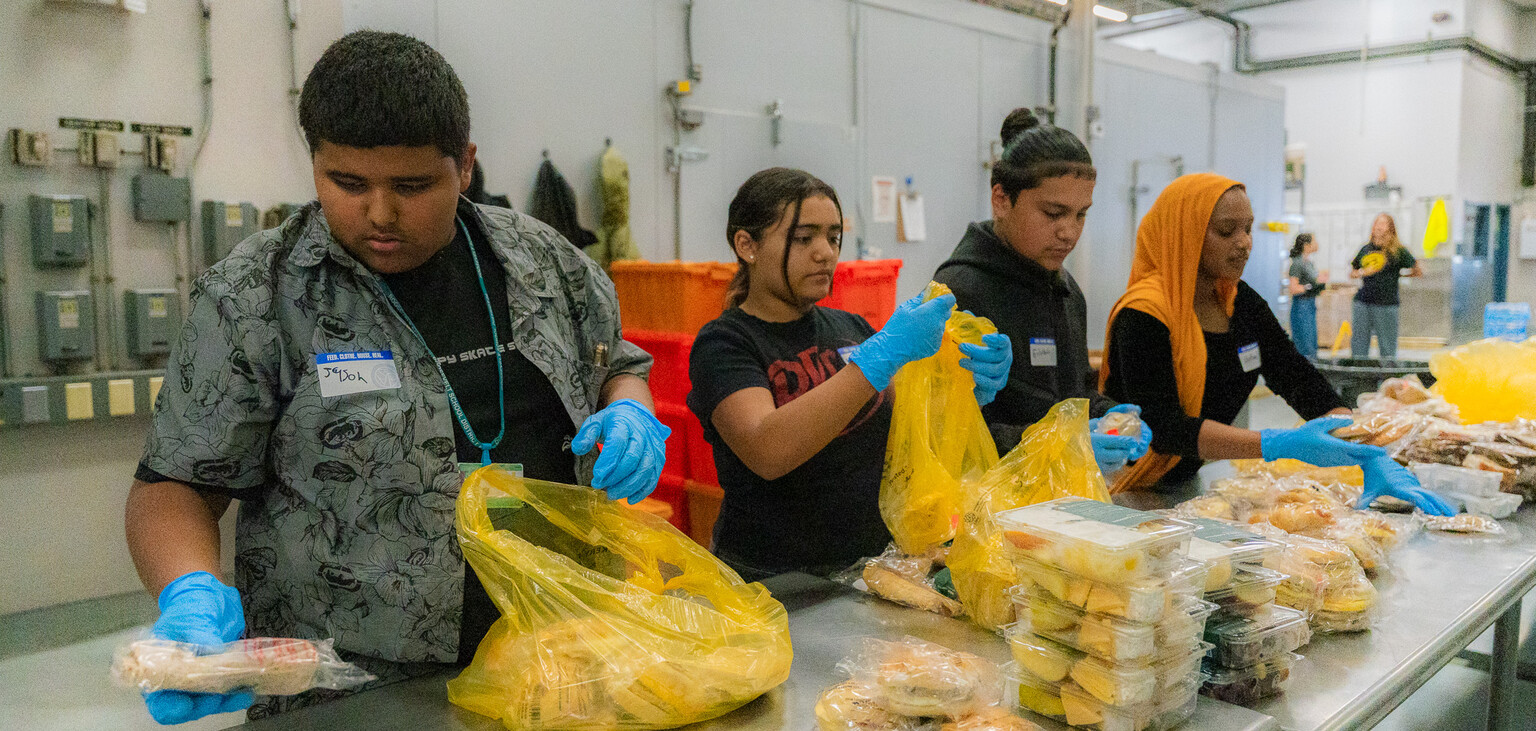 Students from Elevate Phoenix volunteer in SVdP's kitchen.