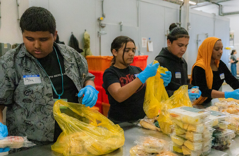 Students from Elevate Phoenix volunteer in SVdP's kitchen.