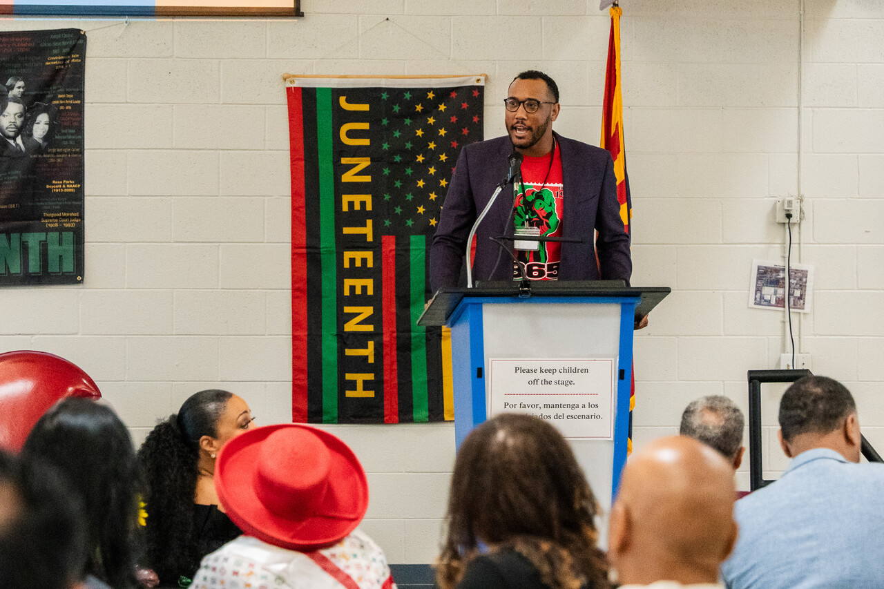 Xavier Walker speaks at the SVdP's 2025 Juneteenth celebration. 